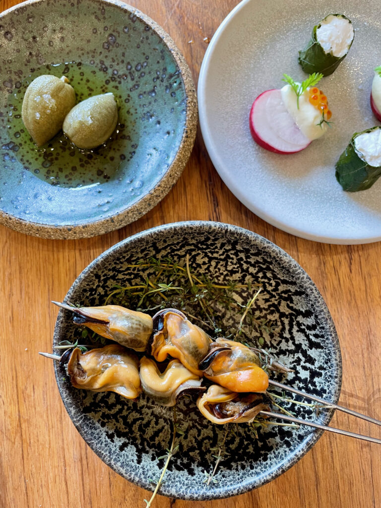 Overhead shot of Sevile Estate starter including Yarra Valley almonds and Mount Martha mussells confit/